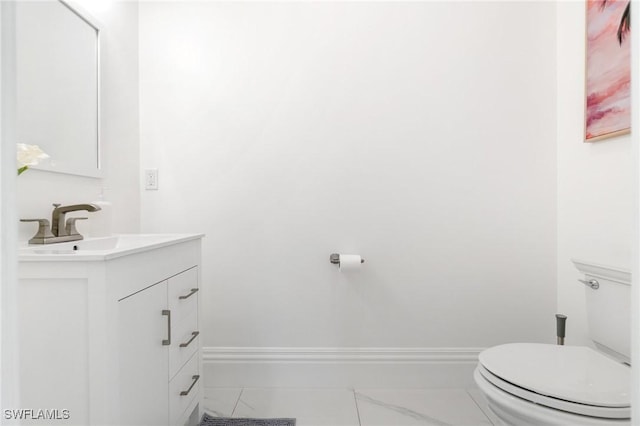 10191 Strike Ln, Bonita Springs, FL 34135 - bathroom with vanity, baseboards, and toilet