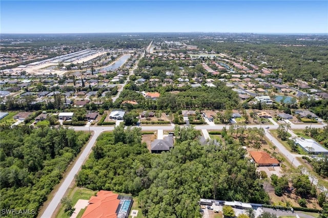 10191 Strike Ln, Bonita Springs, FL 34135 - drone / aerial view featuring a water view and a residential view