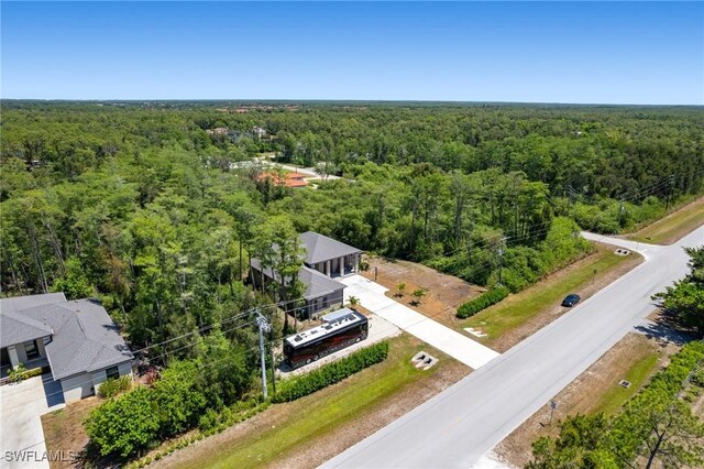 10191 Strike Ln, Bonita Springs, FL 34135 - bird's eye view with a view of trees