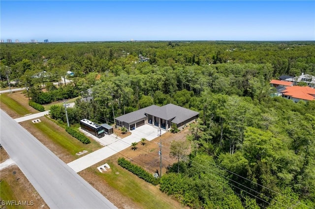 10191 Strike Ln, Bonita Springs, FL 34135 - birds eye view of property featuring a wooded view