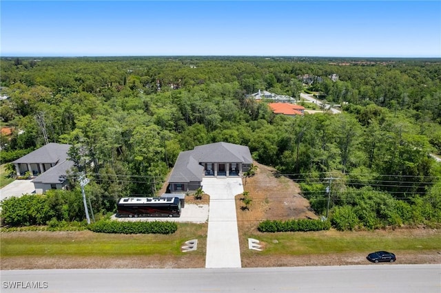 10191 Strike Ln, Bonita Springs, FL 34135 - birds eye view of property with a view of trees