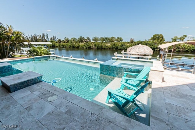 pool with a water view, a gazebo, and a patio area