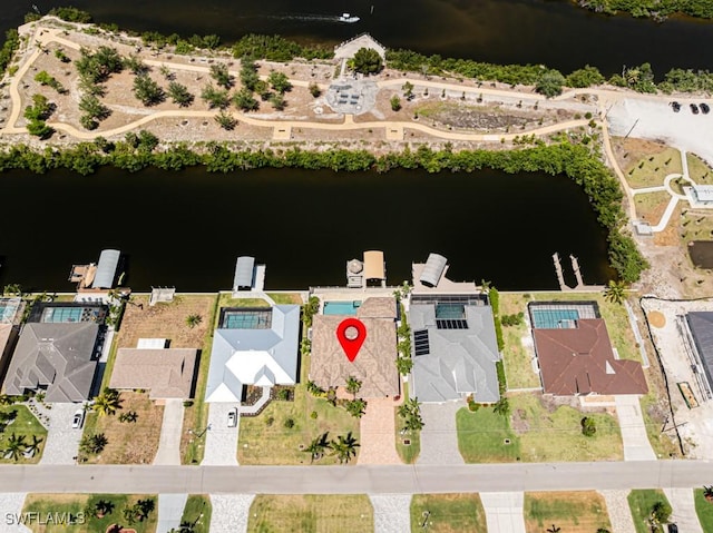 birds eye view of property featuring a water view