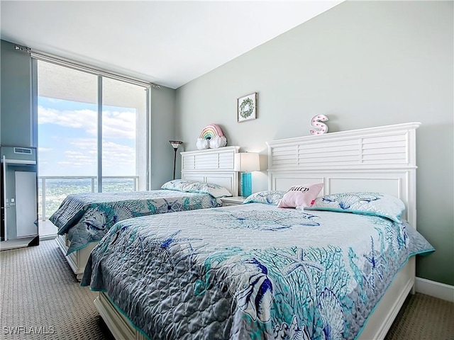 3000 Oasis Grand Blvd, Fort Myers, FL 33916 - bedroom with a wall of windows, carpet flooring, and baseboards