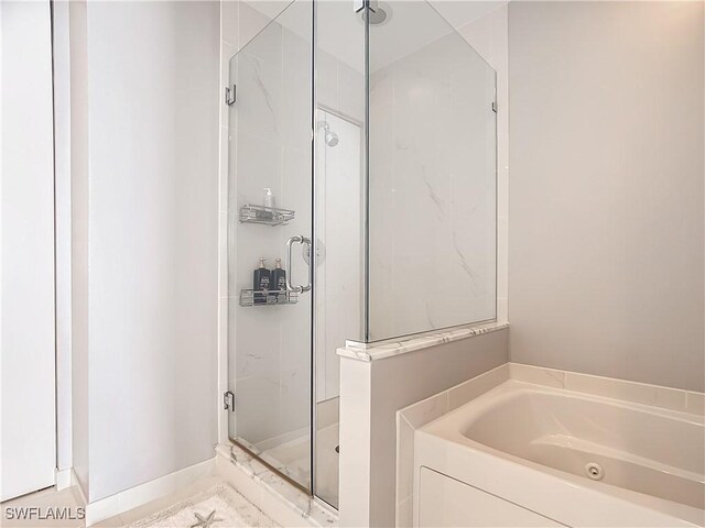 3000 Oasis Grand Blvd, Fort Myers, FL 33916 - full bath featuring a shower stall and a garden tub