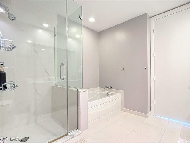 3000 Oasis Grand Blvd, Fort Myers, FL 33916 - full bathroom with a garden tub, tile patterned flooring, a shower stall, and baseboards