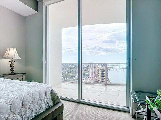 3000 Oasis Grand Blvd, Fort Myers, FL 33916 - carpeted bedroom featuring access to outside and expansive windows