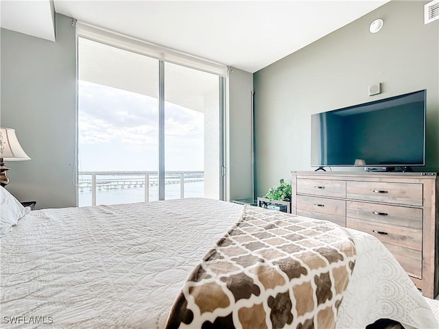 3000 Oasis Grand Blvd, Fort Myers, FL 33916 - bedroom with visible vents, access to outside, and floor to ceiling windows