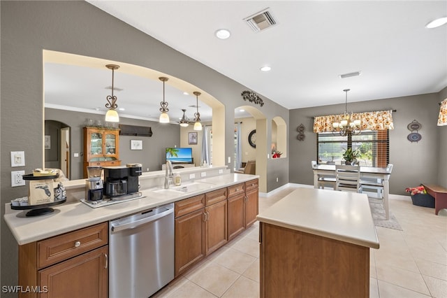 12869 Pastures Way, Fort Myers, FL 33913 - kitchen with dishwasher, light tile patterned flooring, a kitchen island, arched walkways, and recessed lighting