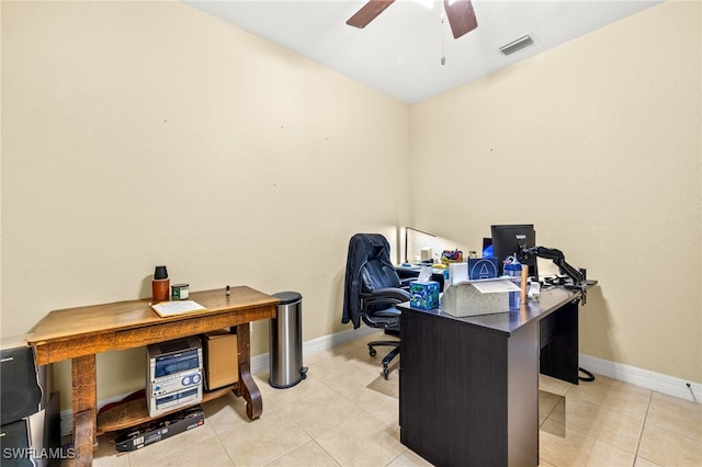 office area featuring baseboards, ceiling fan, light tile patterned flooring, and visible vents