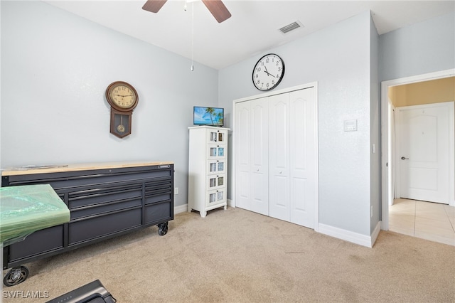 bedroom featuring visible vents, baseboards, a closet, and light colored carpet