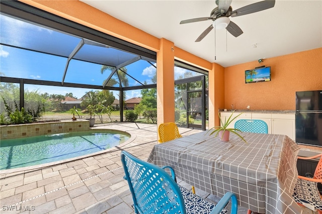 exterior space featuring a ceiling fan and a pool