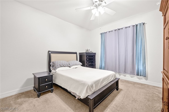 bedroom with baseboards, ceiling fan, and carpet flooring