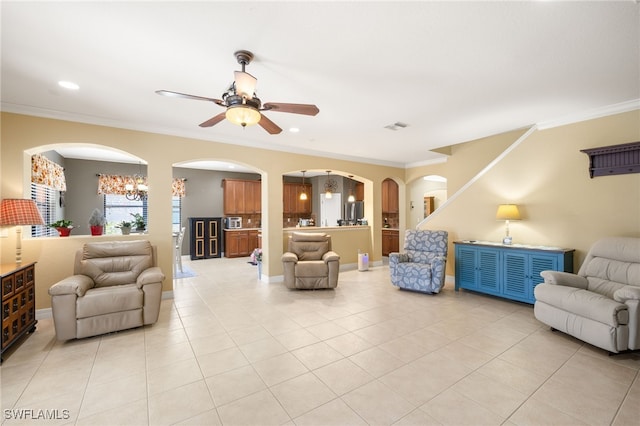 12869 Pastures Way, Fort Myers, FL 33913 - living area featuring ornamental molding, ceiling fan, arched walkways, light tile patterned floors, and recessed lighting