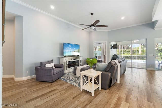 2733 Island Pond Ln, Naples, FL 34119 - living room with light wood finished floors, ceiling fan, baseboards, crown molding, and recessed lighting