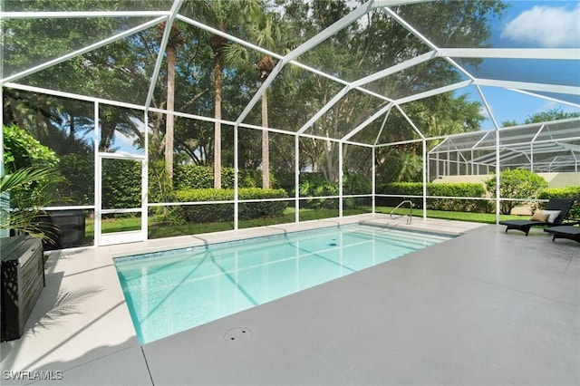 2733 Island Pond Ln, Naples, FL 34119 - swimming pool featuring a patio area and glass enclosure