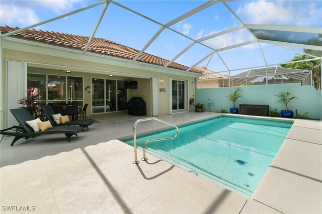 2733 Island Pond Ln, Naples, FL 34119 - view of swimming pool with a patio