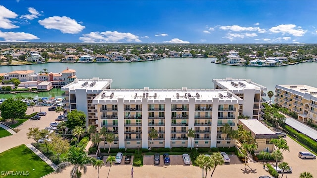 aerial view of a nearby body of water and apartment complex
