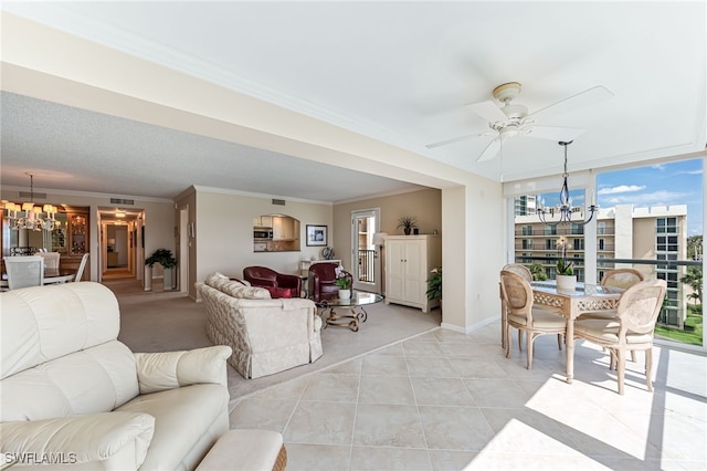 living room featuring a chandelier, ceiling fan, baseboards, light tile patterned floors, and crown molding