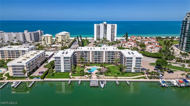 view of urban area with a nearby body of water and apartment complex / building