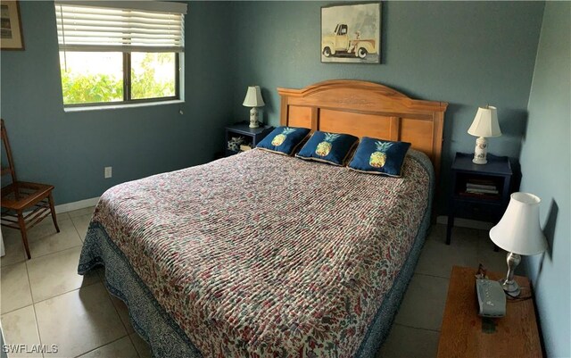 3013 SW 5th Ave, Cape Coral, FL 33914 - bedroom with tile patterned floors and baseboards