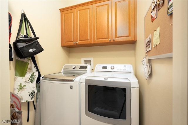 184 Vintage Cir Unit N202, Naples, FL 34119 - laundry room featuring cabinet space and washing machine and dryer