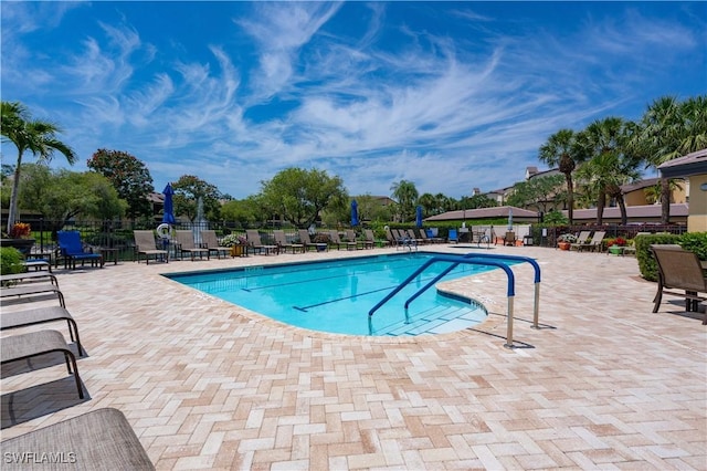 184 Vintage Cir Unit N202, Naples, FL 34119 - community pool with a patio and fence