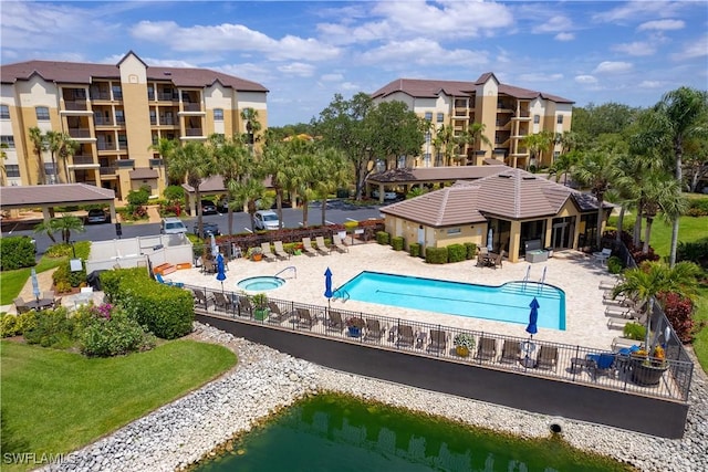 184 Vintage Cir Unit N202, Naples, FL 34119 - community pool with a patio and fence