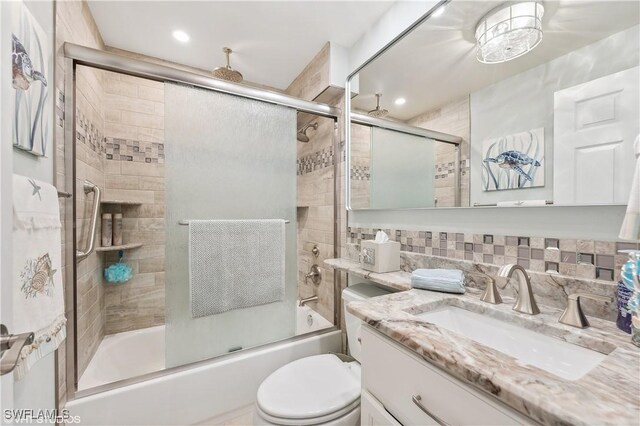 26000 Hickory Blvd Unit 604, Bonita Springs, FL 34134 - full bath with tasteful backsplash, toilet, recessed lighting, a combined bath / shower with rainfall shower, and vanity