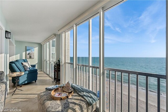 26000 Hickory Blvd Unit 604, Bonita Springs, FL 34134 - sunroom / solarium featuring a view of the beach, plenty of natural light, and a water view