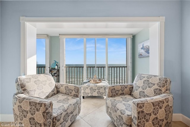 26000 Hickory Blvd Unit 604, Bonita Springs, FL 34134 - sitting room with a water view and tile patterned floors