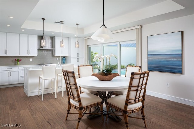 4830 W Blvd, Naples, FL 34103 - dining room with a tray ceiling, recessed lighting, and dark wood finished floors
