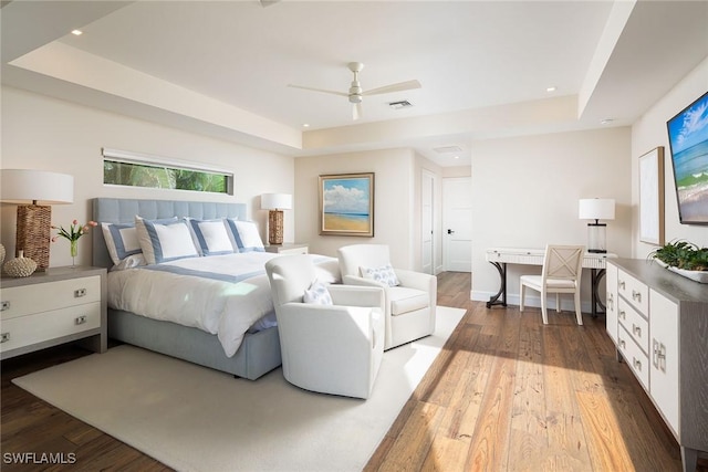 4830 W Blvd, Naples, FL 34103 - bedroom with a tray ceiling, wood finished floors, recessed lighting, and ceiling fan