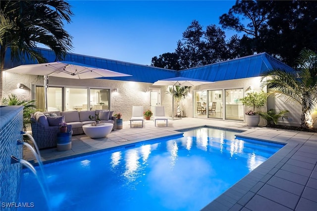 4830 W Blvd, Naples, FL 34103 - swimming pool with a patio area and an outdoor living space