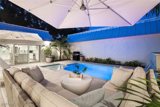 4830 W Blvd, Naples, FL 34103 - view of swimming pool with an outdoor living space, an outdoor kitchen, and a patio area