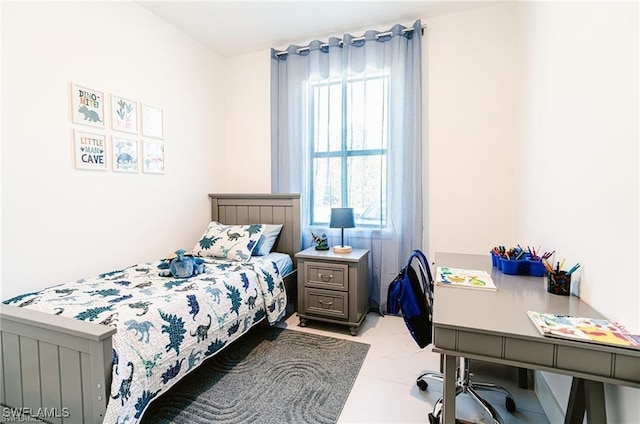 bedroom featuring multiple windows