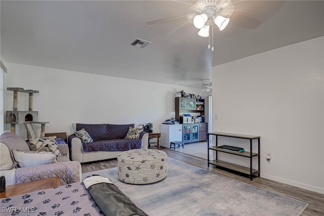 2215 Marilyn Ln, Fort Myers, FL 33905 - living room featuring a ceiling fan, baseboards, visible vents, and wood finished floors