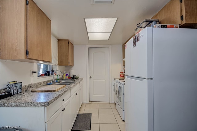 2215 Marilyn Ln, Fort Myers, FL 33905 - kitchen featuring a sink, light tile patterned floors, white appliances, and light countertops
