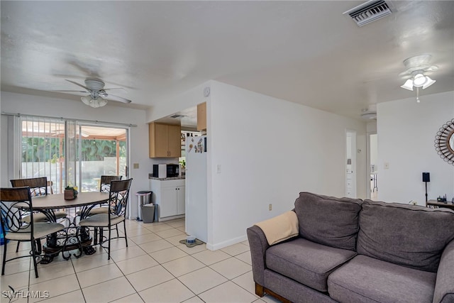 2215 Marilyn Ln, Fort Myers, FL 33905 - living area featuring baseboards, ceiling fan, visible vents, and light tile patterned floors