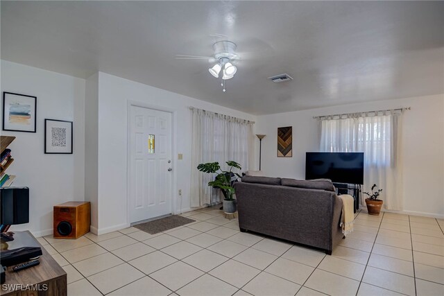 2215 Marilyn Ln, Fort Myers, FL 33905 - living area with baseboards, a ceiling fan, and light tile patterned floors