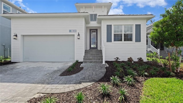 17825 Summerland Key Ct, Fort Myers, FL 33908 - view of front of house featuring decorative driveway and an attached garage