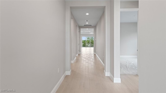17825 Summerland Key Ct, Fort Myers, FL 33908 - hallway with light wood-type flooring, baseboards, and recessed lighting