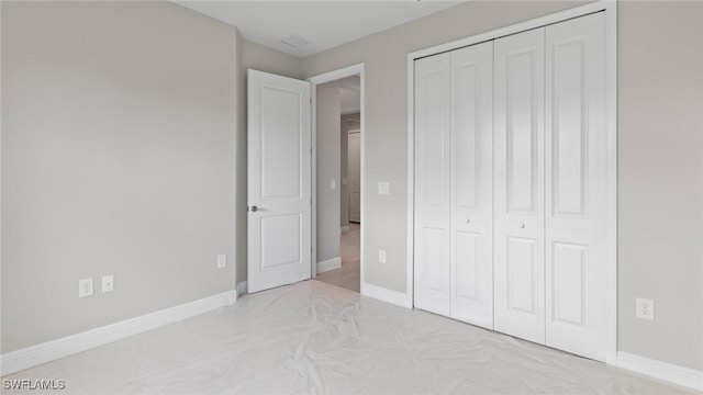 17825 Summerland Key Ct, Fort Myers, FL 33908 - unfurnished bedroom featuring a closet and baseboards