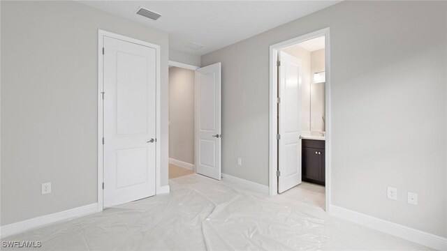 17825 Summerland Key Ct, Fort Myers, FL 33908 - unfurnished bedroom with baseboards and ensuite bath