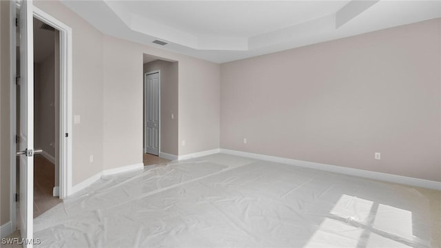 17825 Summerland Key Ct, Fort Myers, FL 33908 - empty room with a tray ceiling and baseboards