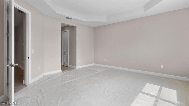 17825 Summerland Key Ct, Fort Myers, FL 33908 - empty room with a raised ceiling and baseboards