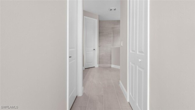 17825 Summerland Key Ct, Fort Myers, FL 33908 - corridor featuring light tile patterned floors and baseboards