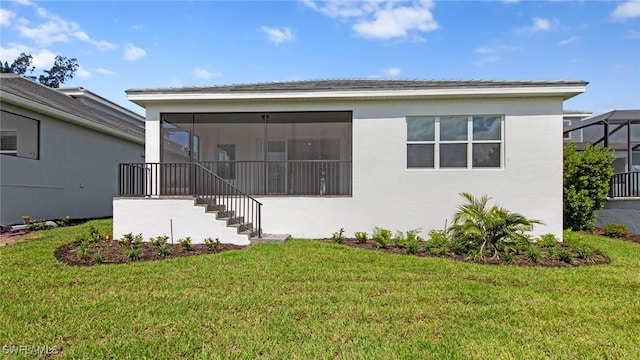 17825 Summerland Key Ct, Fort Myers, FL 33908 - back of house with a sunroom, a yard, stucco siding, and stairs