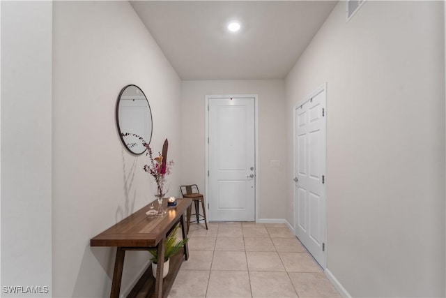 17152 Ashford Ter, Fort Myers, FL 33967 - doorway to outside featuring baseboards and light tile patterned flooring