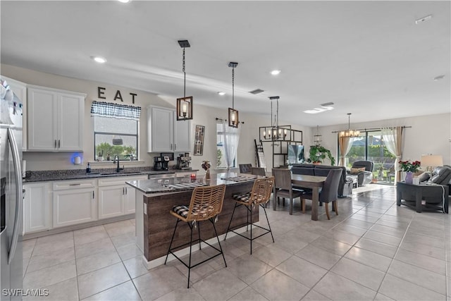 17152 Ashford Ter, Fort Myers, FL 33967 - kitchen featuring recessed lighting, a sink, light tile patterned flooring, and white cabinets